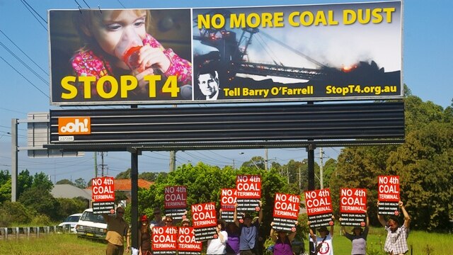A community-funded billboard on the Pacific Highway in Newcastle as part of a campaign to halt the proposed T4 coal terminal.