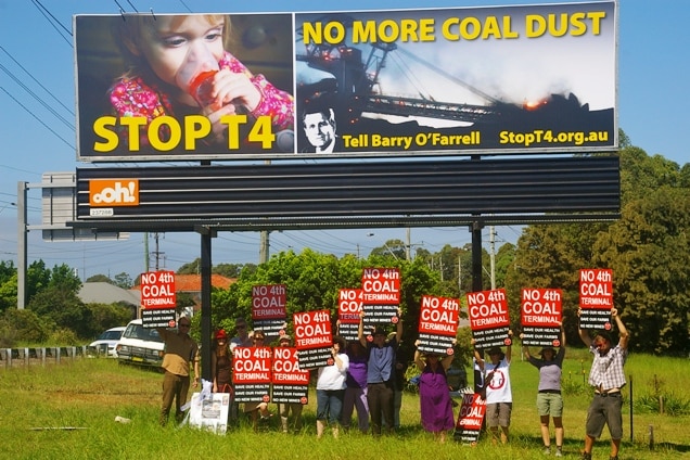 A community-funded billboard on the Pacific Highway in Newcastle as part of a campaign to halt the proposed T4 coal terminal.