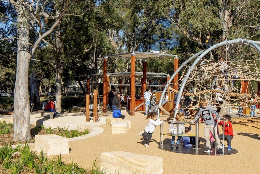 Children playing on outdoor play equipment