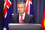 Health Minister Roger Cook at the border announcement