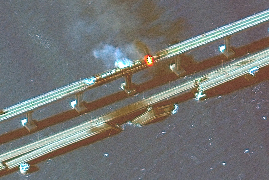 Satellite image shows fire on bridge. 