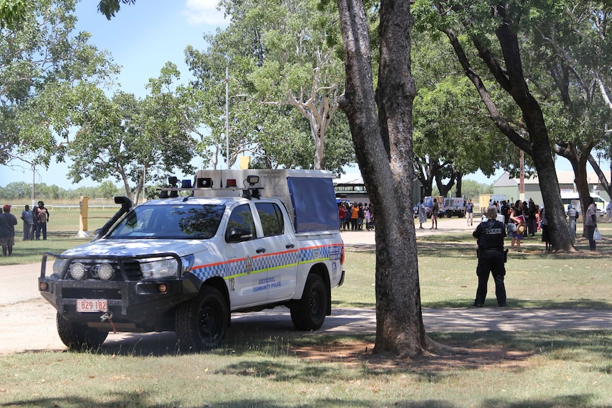 Police stand outside a showground in Katherine.