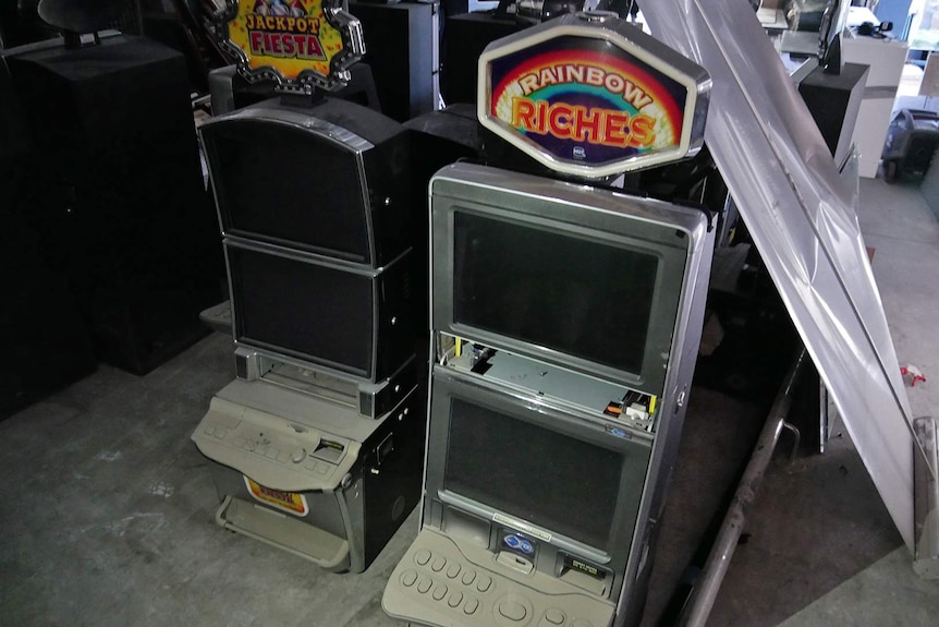 Two gaming machines stand next to each other turned off
