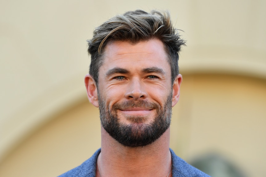 Chris Hemsworth smiles.