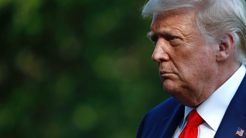 President Donald Trump walks on the South Lawn of the White House in Washington after stepping off Marine One