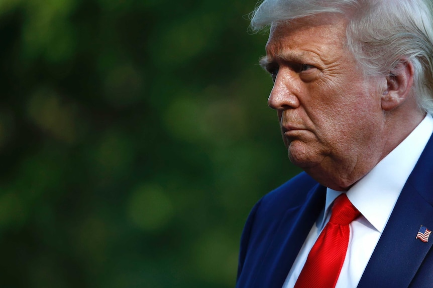 President Donald Trump walks on the South Lawn of the White House in Washington after stepping off Marine One