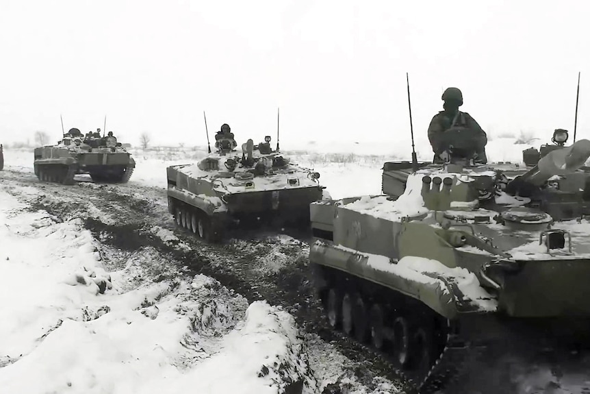Army tanks line up in snow 