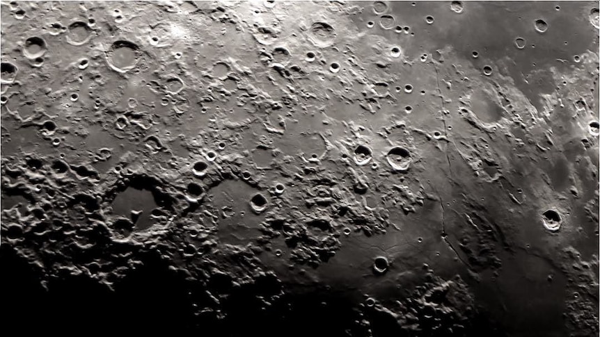 Very, very close up image of the moon showing craters