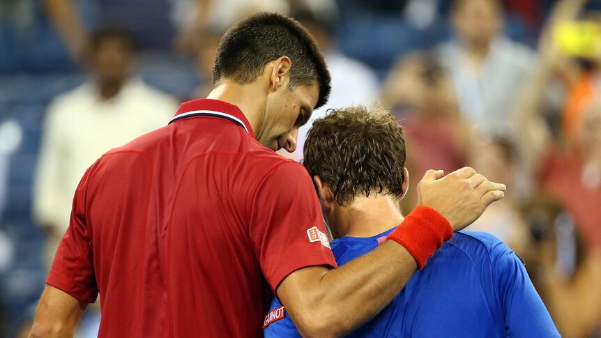 Straight sets ... Novak Djokovic consoles Diego Schwartzman after his first-round win