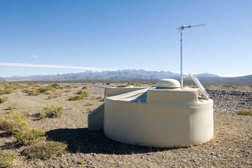 An Auger Observatory detector, with mountains in the background