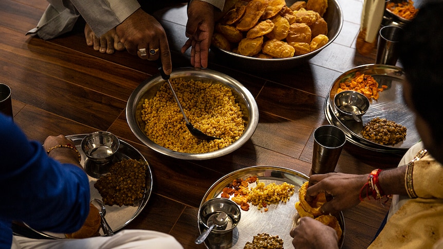 Jain breakfast being served on the floor.