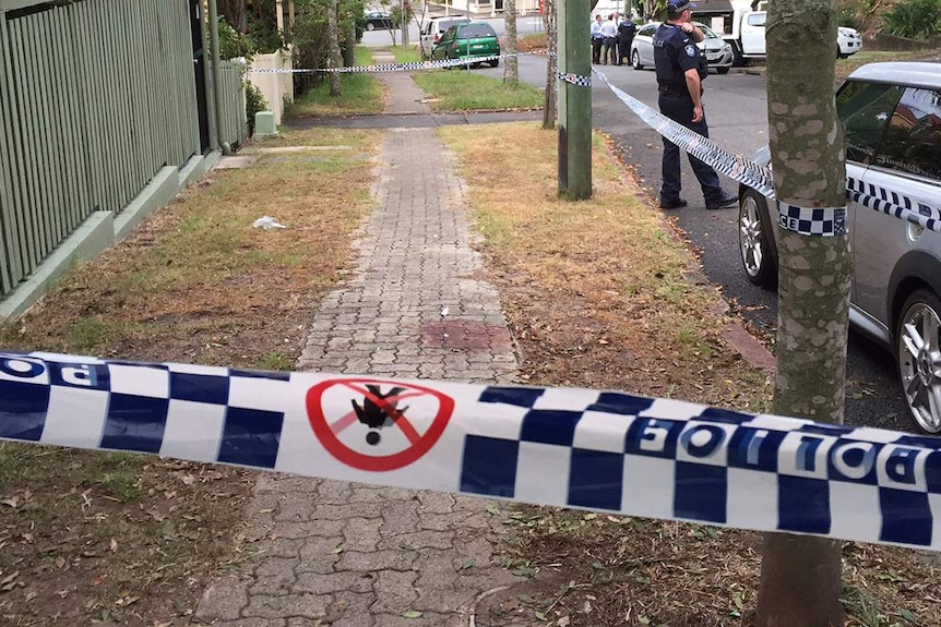 Blood on the footpath in Spring Hill where the man was found after he was stabbed.