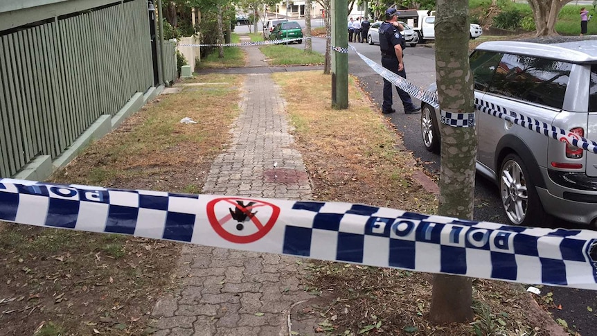 Blood on the footpath in Spring Hill where the man was found after he was stabbed.