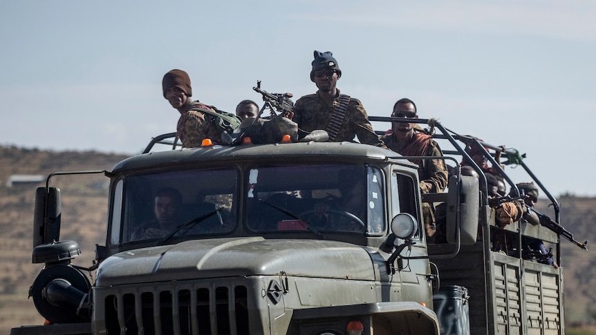 Ethiopian government soldiers ride in the back of a truck in the Tigray region of northern Ethiopia.
