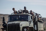 Ethiopian government soldiers ride in the back of a truck in the Tigray region of northern Ethiopia.