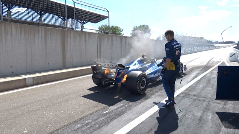 Carlos Sainz car catching fire.