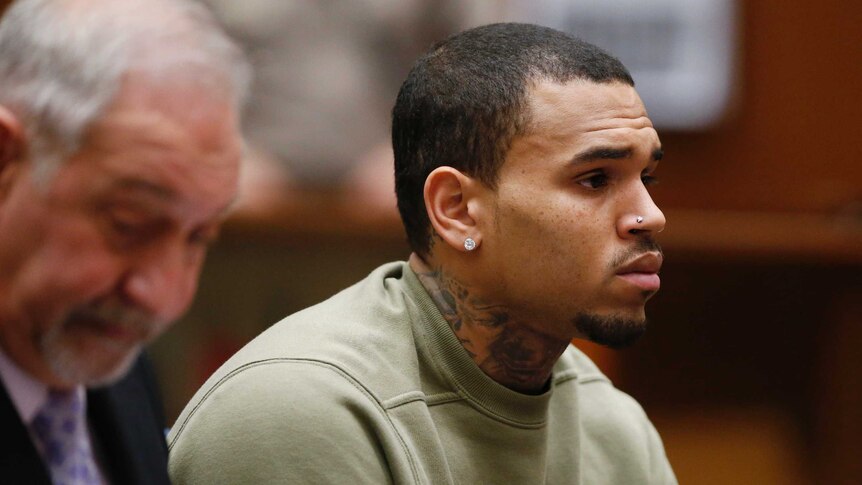 Chris Brown stares straight ahead