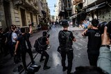 Turkish riot police officers fire rubber bullets to disperse LGBT protesters.