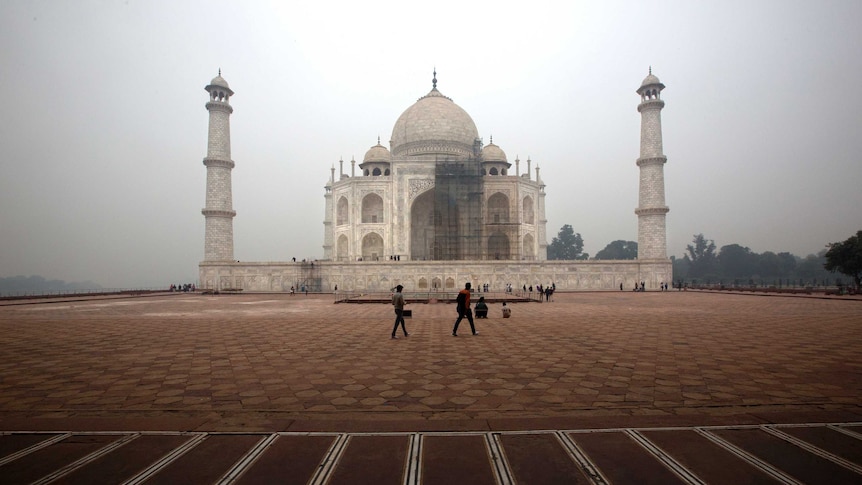 Tourists visit the Taj Mahal in India