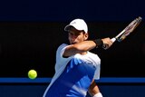 Novak Djokovic hits a forehand