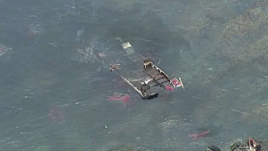 A truck is submerged in water.