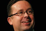 Alan Joyce can smile again after Qantas posted a $203 million net profit in the first half of 2015.