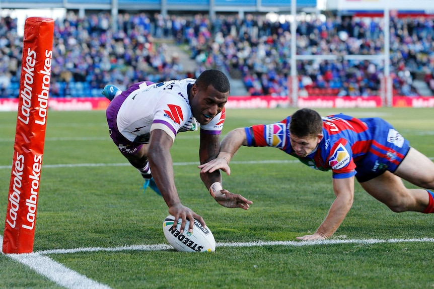 Suliasi Vunivalu of the Storm scores a try against the Knights in Newcastle on June 17, 2018.