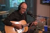 Paul Kelly performing in the ABC Radio Melbourne studio.