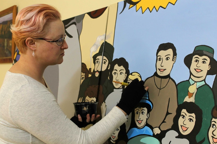 Artist Lisa Dittmann helps restore the Great Elephant Race mural