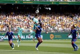 Sam Kerr jumps up for headbutt at ball in soccer game