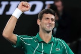 A tennis player pumps his fist in victory after winning the Australian Open.