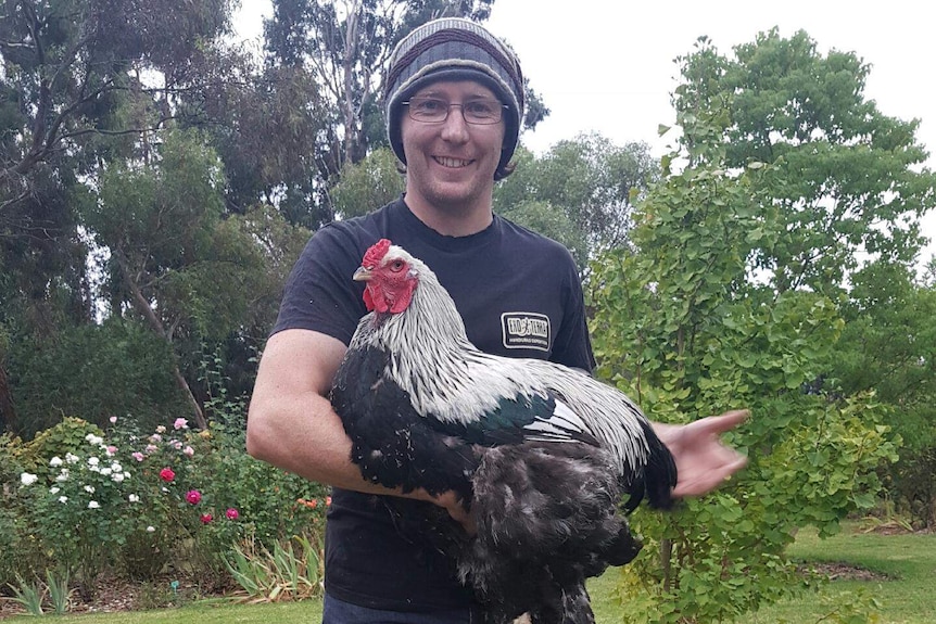 Luke Price and Bazza the chicken.