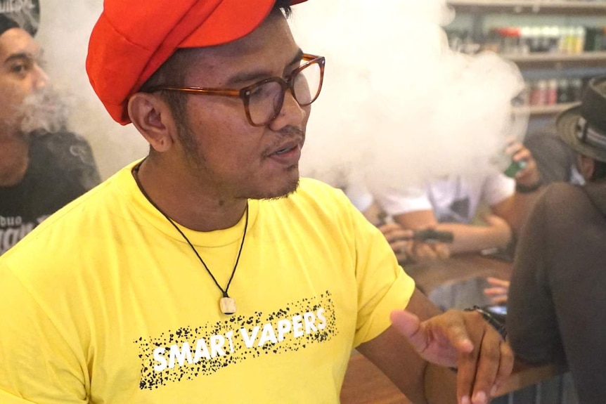 A young man vapes in an inner-city vape bar in Jakarta, Indonesia.