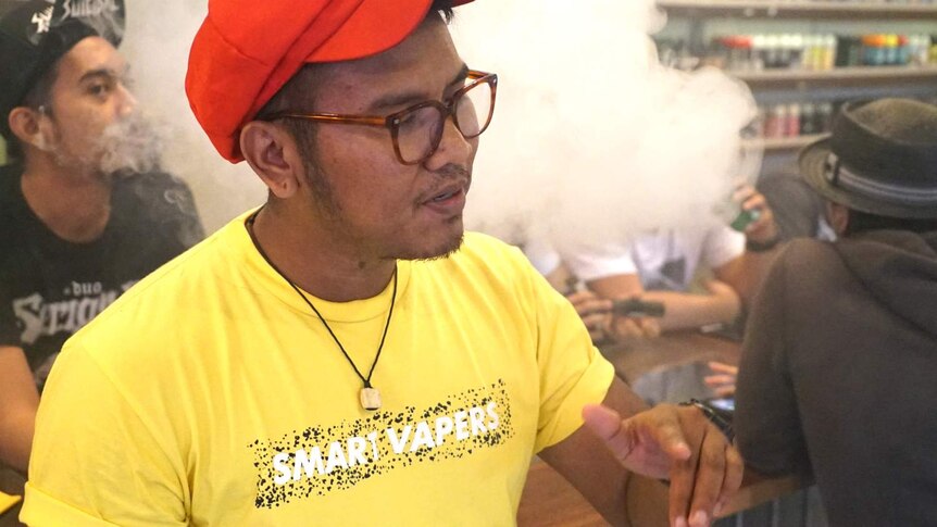 A young man vapes in an inner-city vape bar in Jakarta, Indonesia.