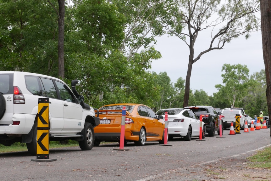 A line of cars queueing for Covid-19 tests in a carpark