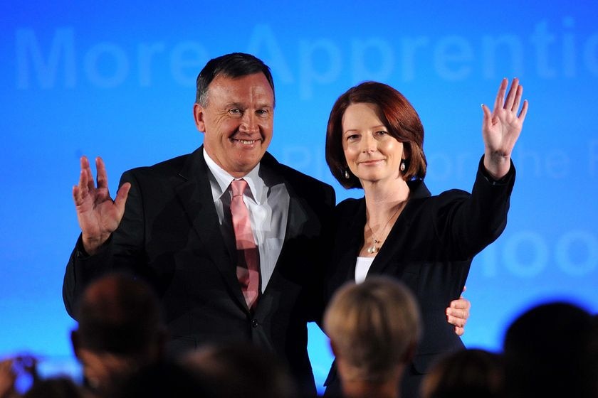 Julia Gillard and Tim Mathieson on stage at a Labor Party campaign launch.