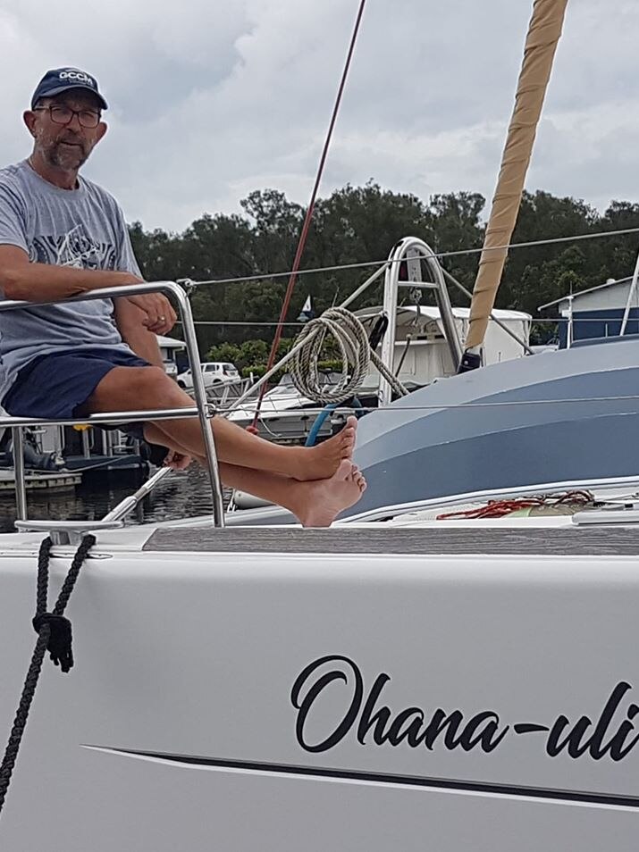 Craig sits on board catamaran boat named 'Ohana-Uli'.