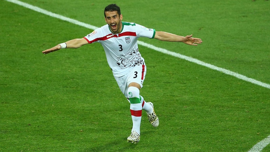 Ehsan Hajsafi celebrates his goal for Iran against Bahrain at the Asian Cup in Melbourne.