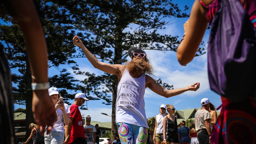 Tommy Franklin dancing in the middle of a crowd