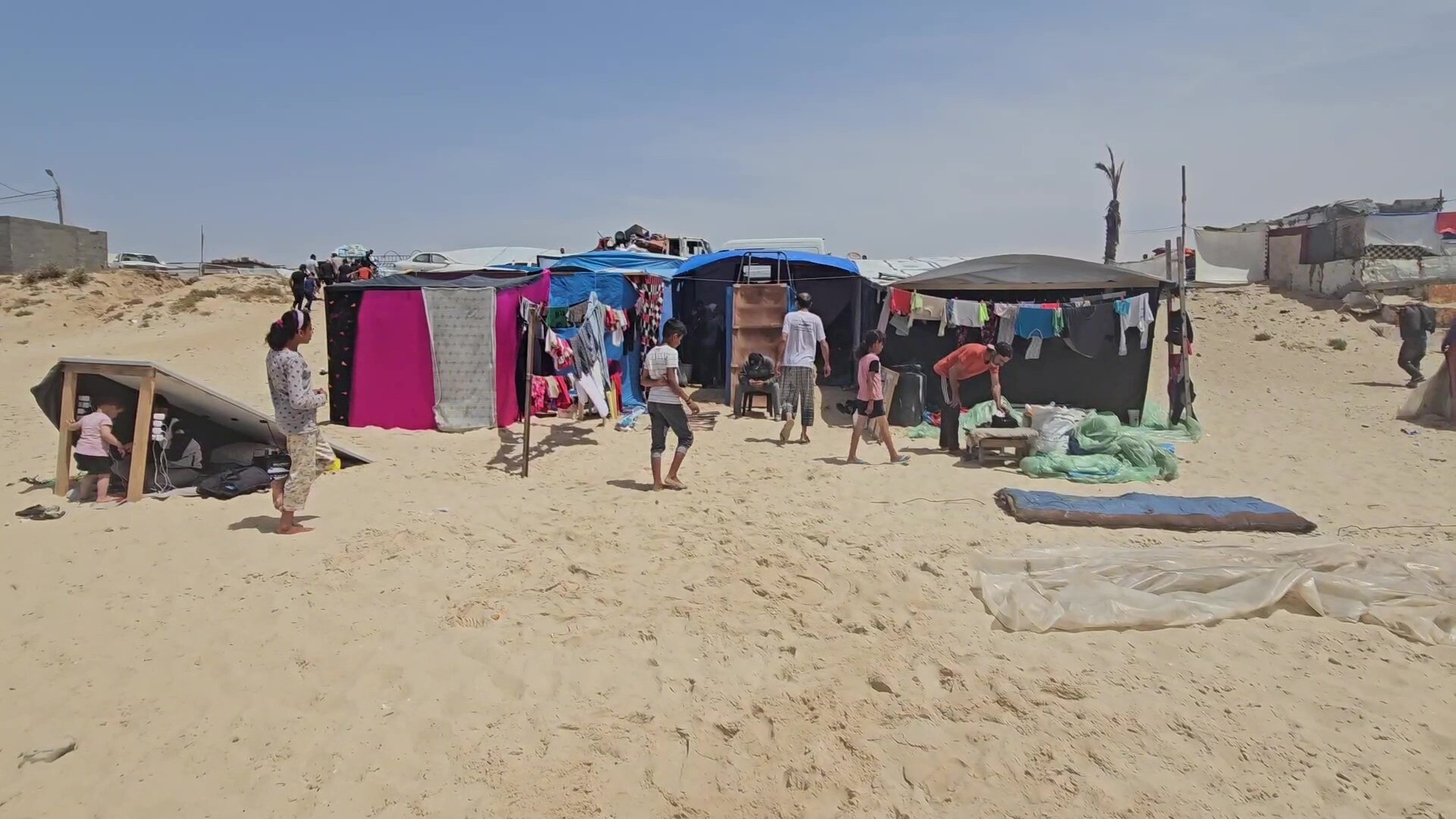 A make-shift tent on a sandy beach