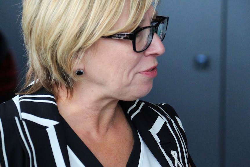 Rosie Batty wearing the emblem of White Ribbon Day