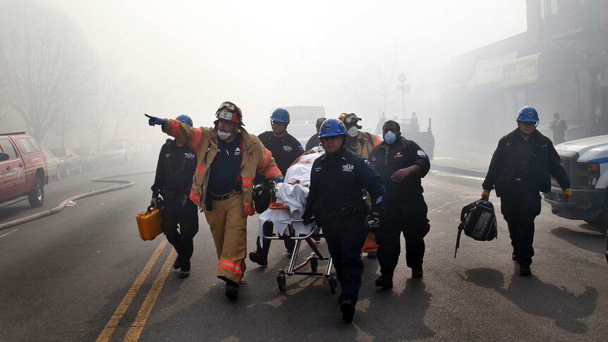 A victim is evacuated by emergency personnel