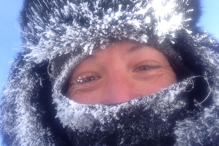 Angela Maxwell wearing a snow covered trapper hat