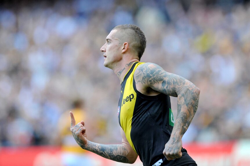 Dustin Martin reacts after kicking a goal for the Tigers against the Eagles at the MCG.