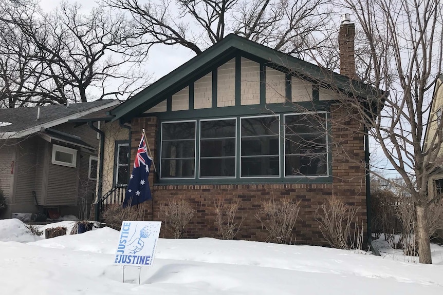 A Justice for Justine sign is seen out the front of Justine Damond Ruszczyk's house.