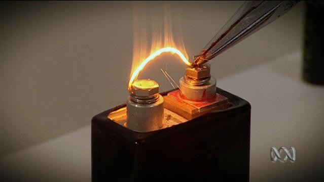 A wire glows hot between two battery nodes
