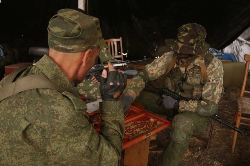 New recruits to the Novo Russian Foreign Legion relax after intensive training near Donetsk.