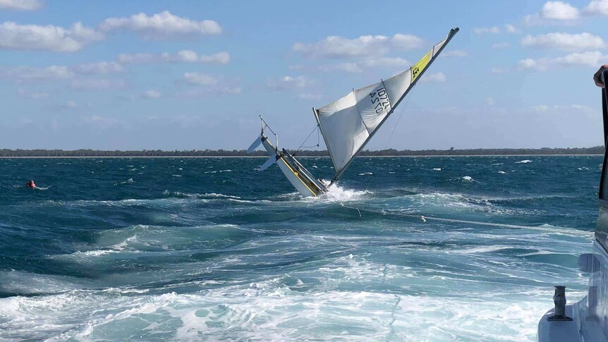 A catamaran tipped on its side.
