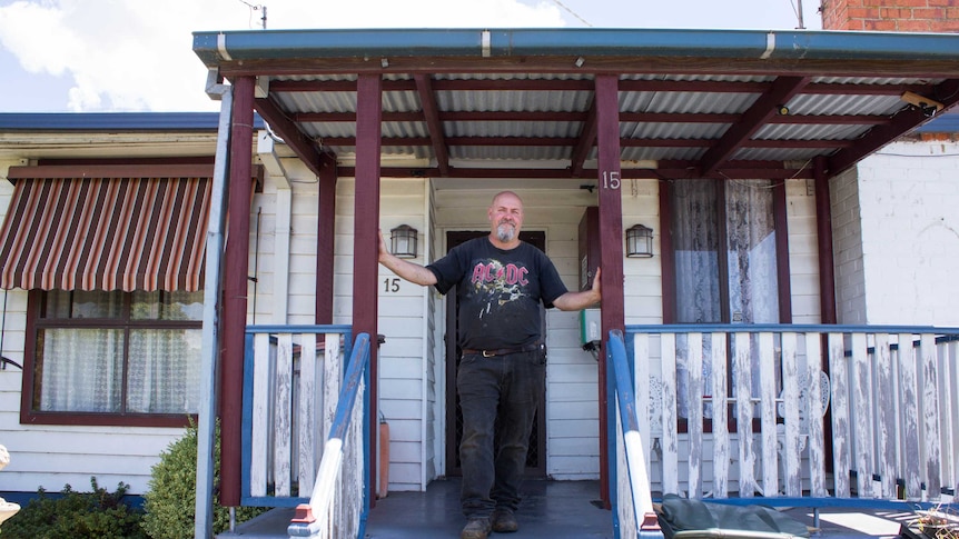 Craig Gittos standing on his porch in Morwell, Gippsland.