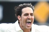 Mitchell Johnson celebrates the wicket of Ross Taylor